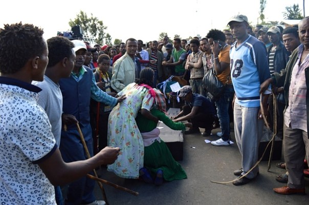  Protesters surround a makeshift coffin in the town of Wolenkomi in Ethiopia’s Oromia region. Photograph: William Davison